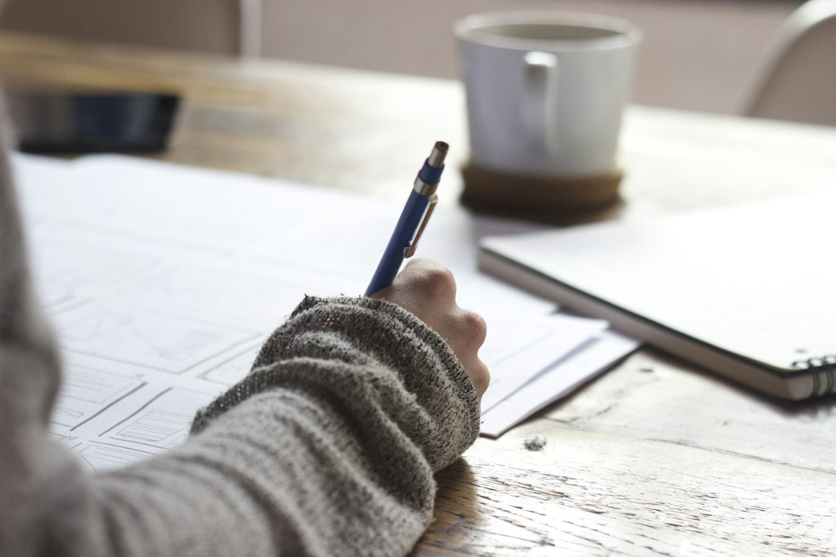 Student writing the matric exam — BISE Karachi BSEK matric result, how to check online and by SMS
