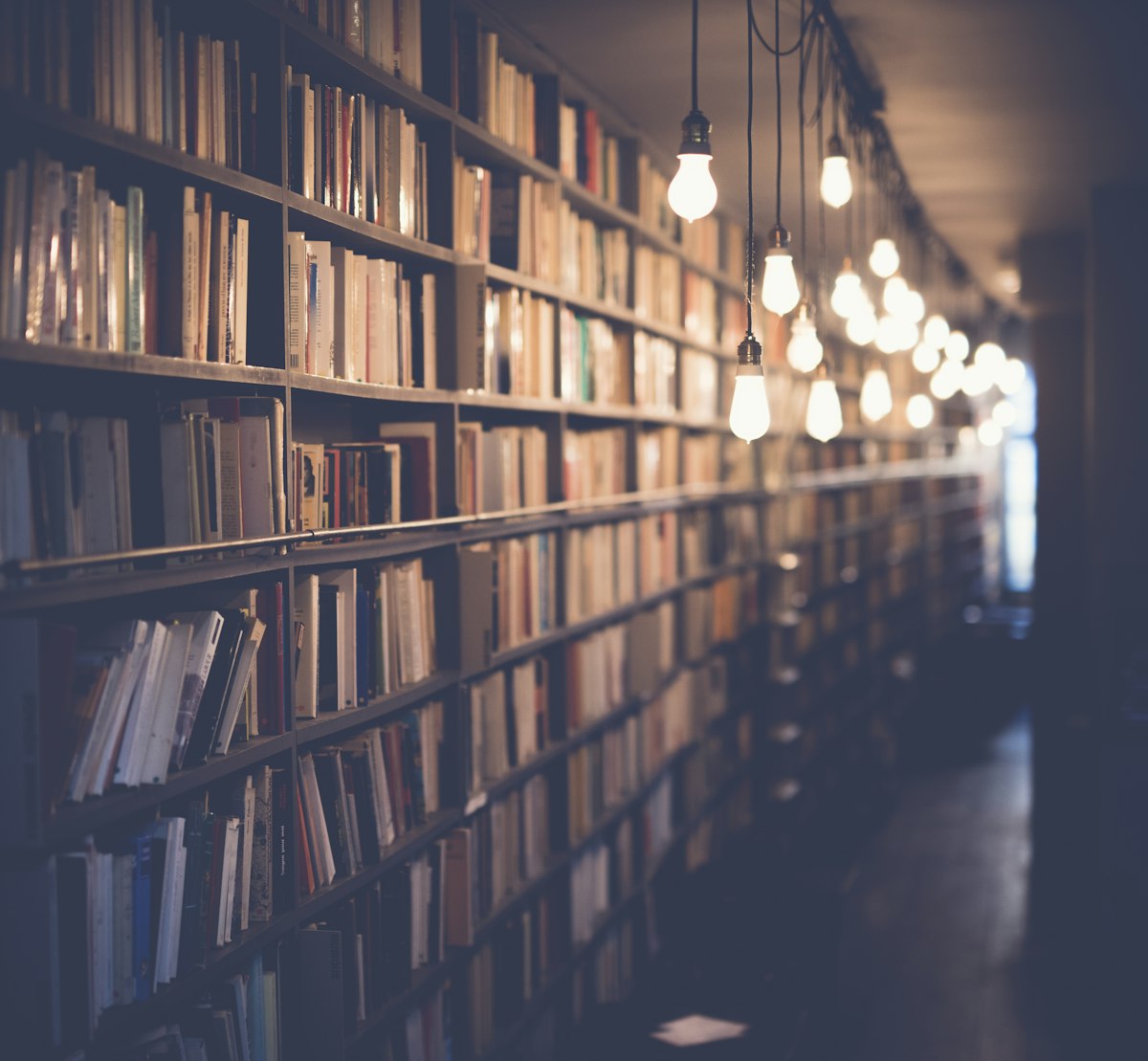Library bookshelves — FBISE Federal Board intermediate guide for admissions, date sheets and results